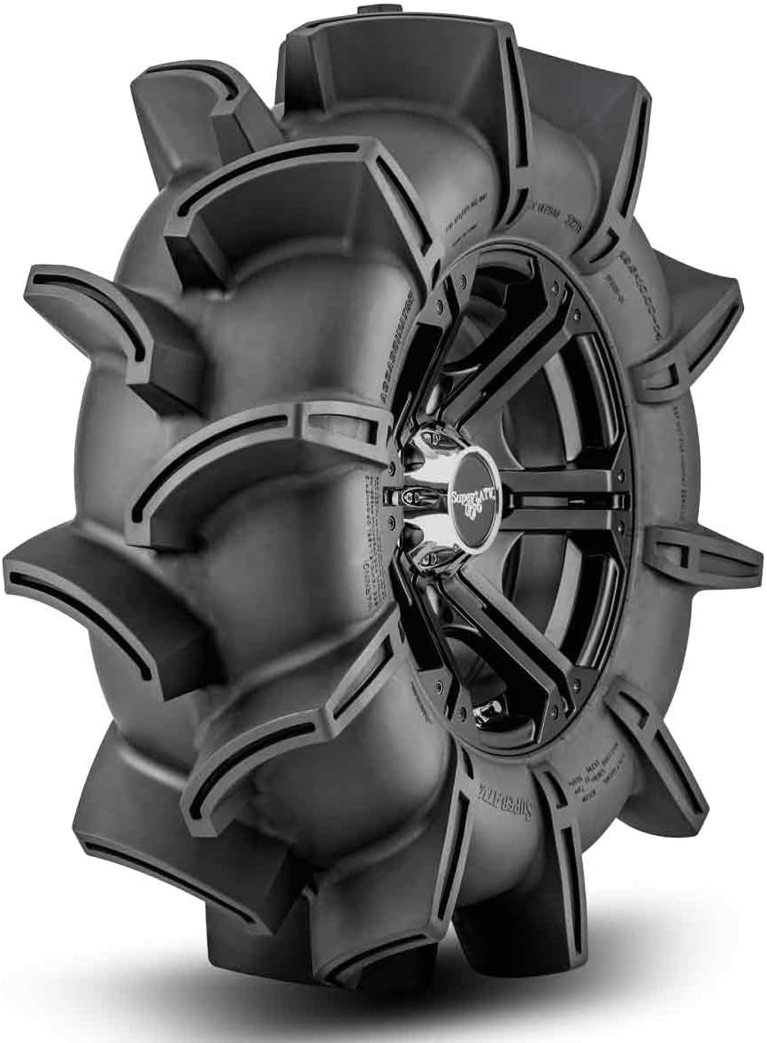 SuperATV Assassinator mud tire mounted on a black machined wheel, tall paddle lugs standing well clear of the casing